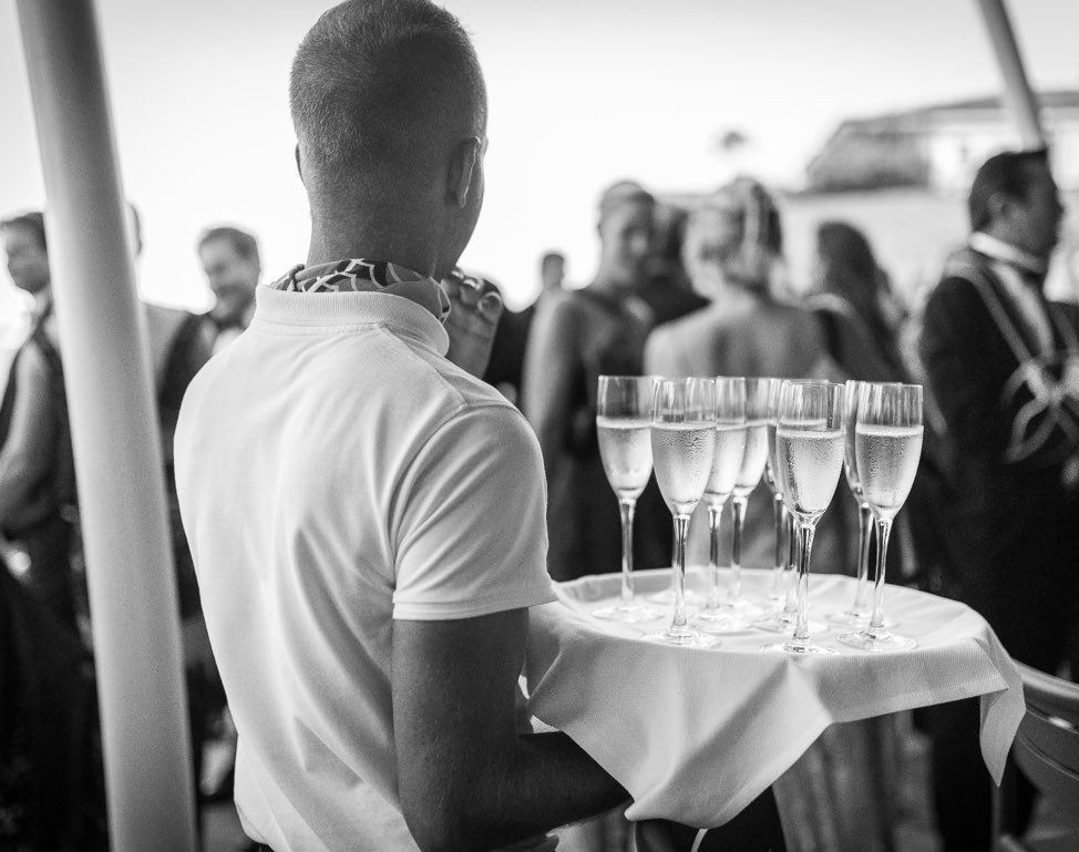 Waiter holding a tray of champagne glasses